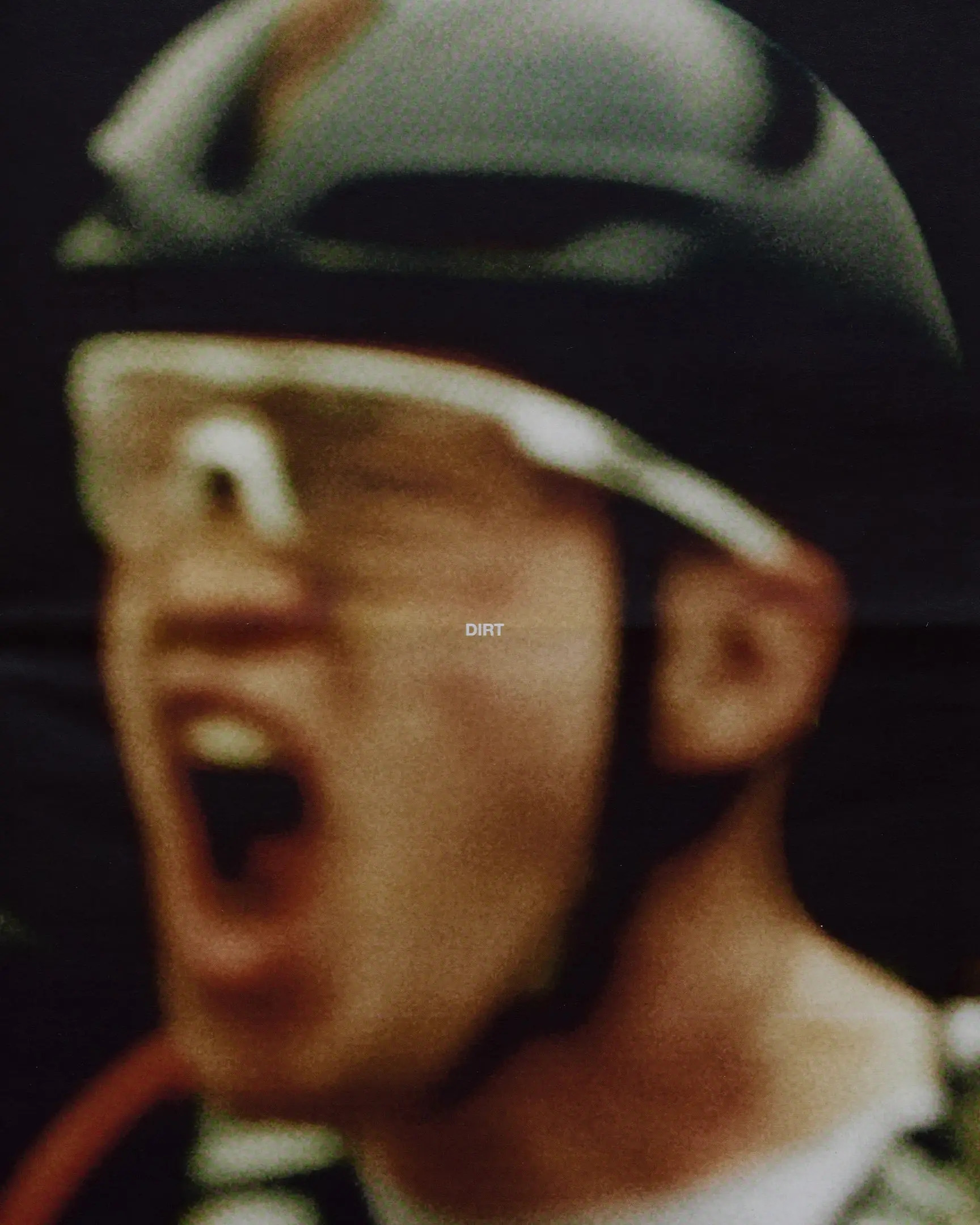 Gravel bike racer crossing the finish line, yelling in excitement. The Rift gravel bike race takes place in Iceland annually. Shot for a personal project and self-published tabloid size newsprint that covers The Rift Gravel Bike Race in Iceland in 2023.