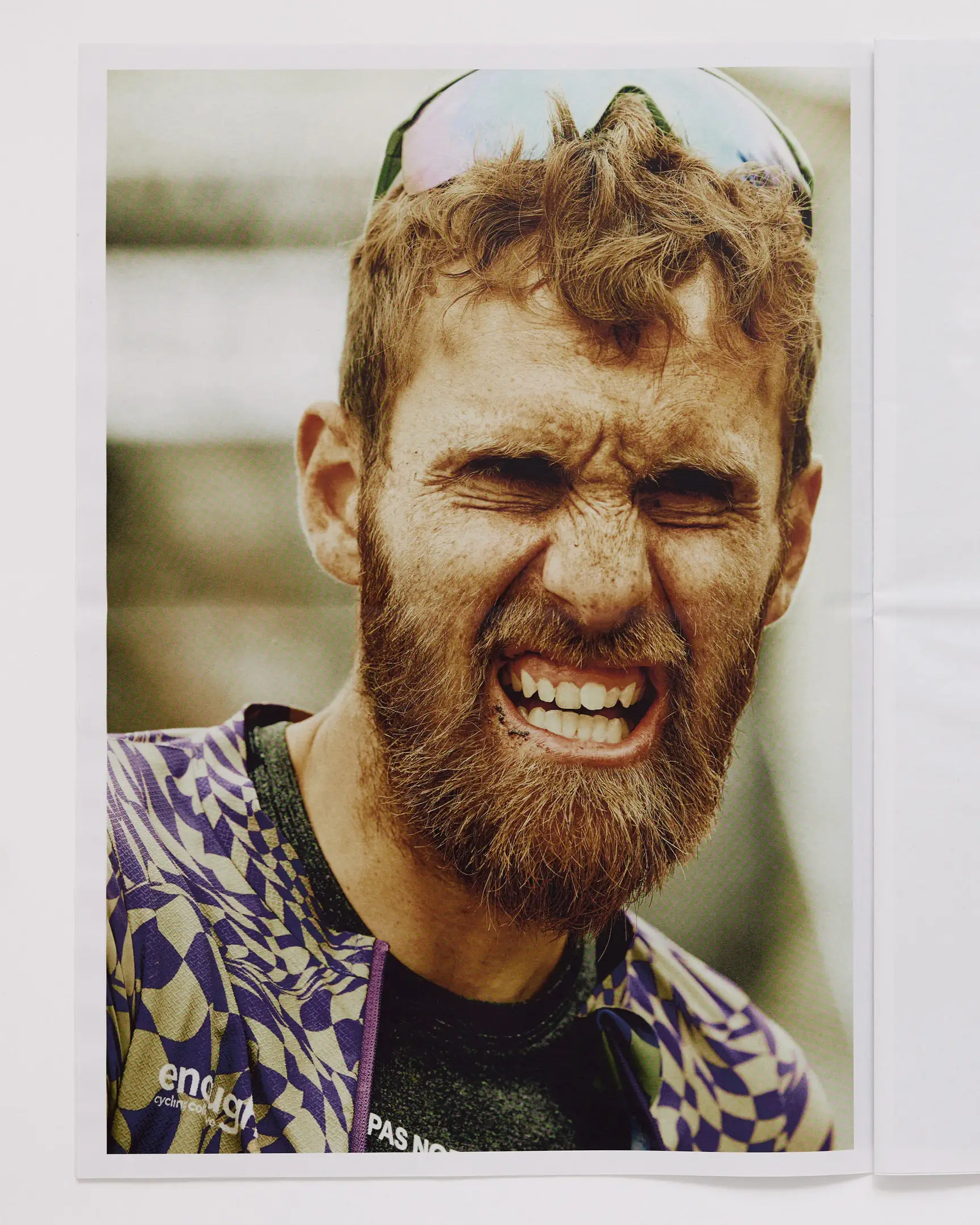 Racer moments after finishing the gravel bike race, with dirt on his face. The Rift gravel bike race takes place in Iceland annually. Shot for a personal project and self-published tabloid size newsprint that covers The Rift Gravel Bike Race in Iceland in 2023.