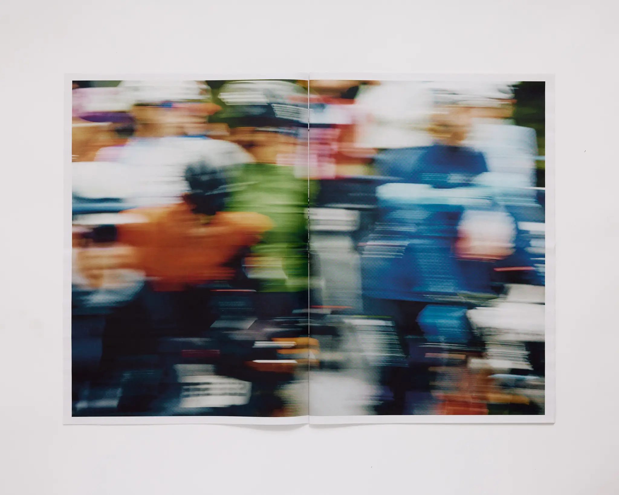 Many bike racers starting the race, moving so fast there's a motion blur. The Rift gravel bike race takes place in Iceland annually. Shot for a personal project and self-published tabloid size newsprint that covers The Rift Gravel Bike Race in Iceland in 2023.