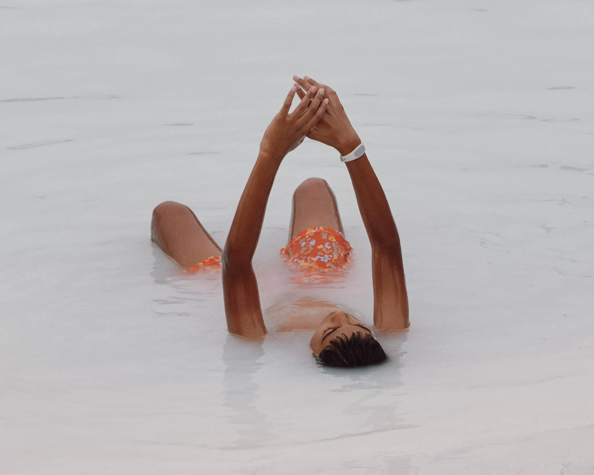 Boy raising his arms within the Blue Lagoon in Iceland, near Reykjavik. Iceland project was shot and completed over the course of ten days all over the island of Iceland. 