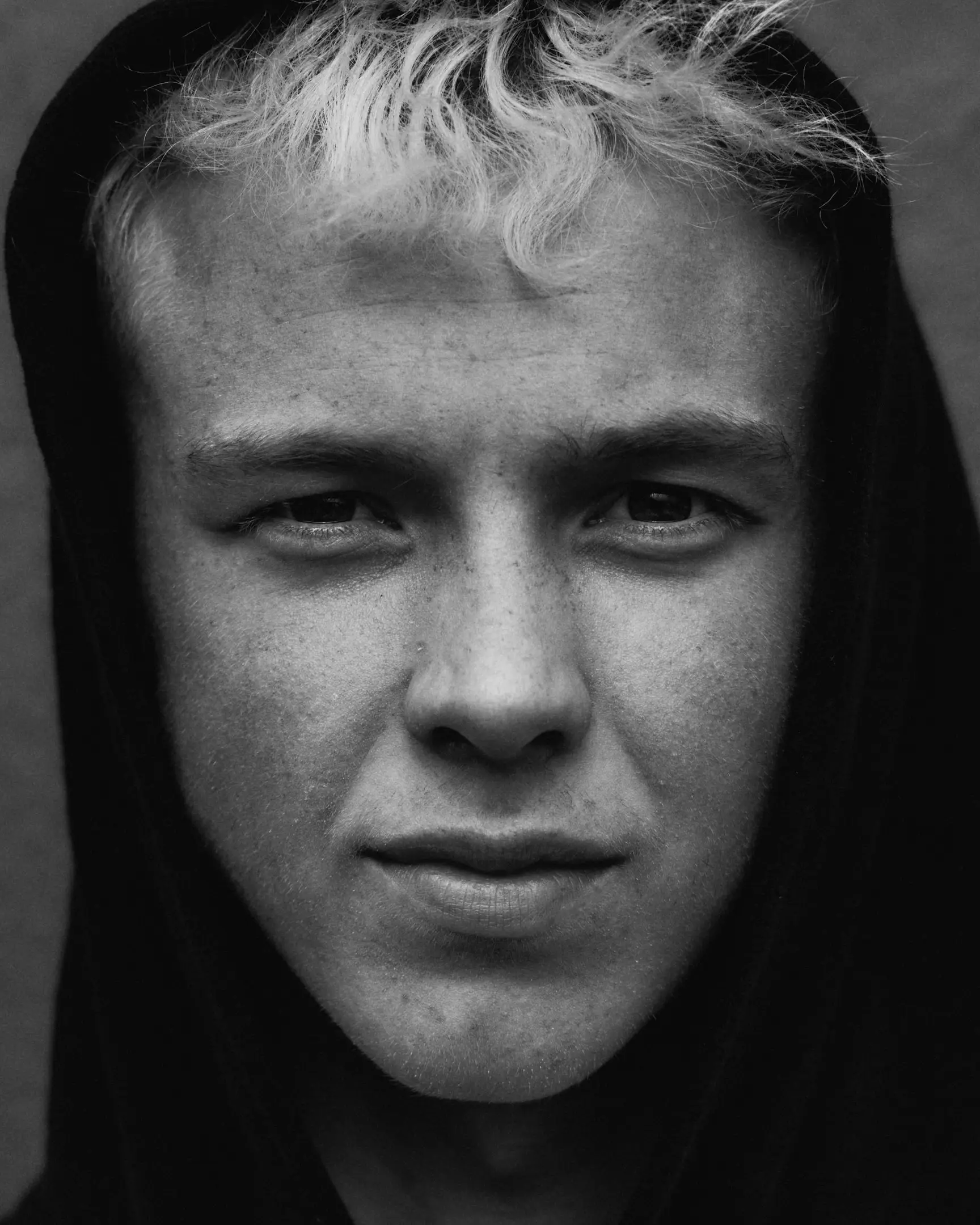 Black and white portrait of a young man in Iceland. Iceland project was shot and completed over the course of ten days all over the island of Iceland. 