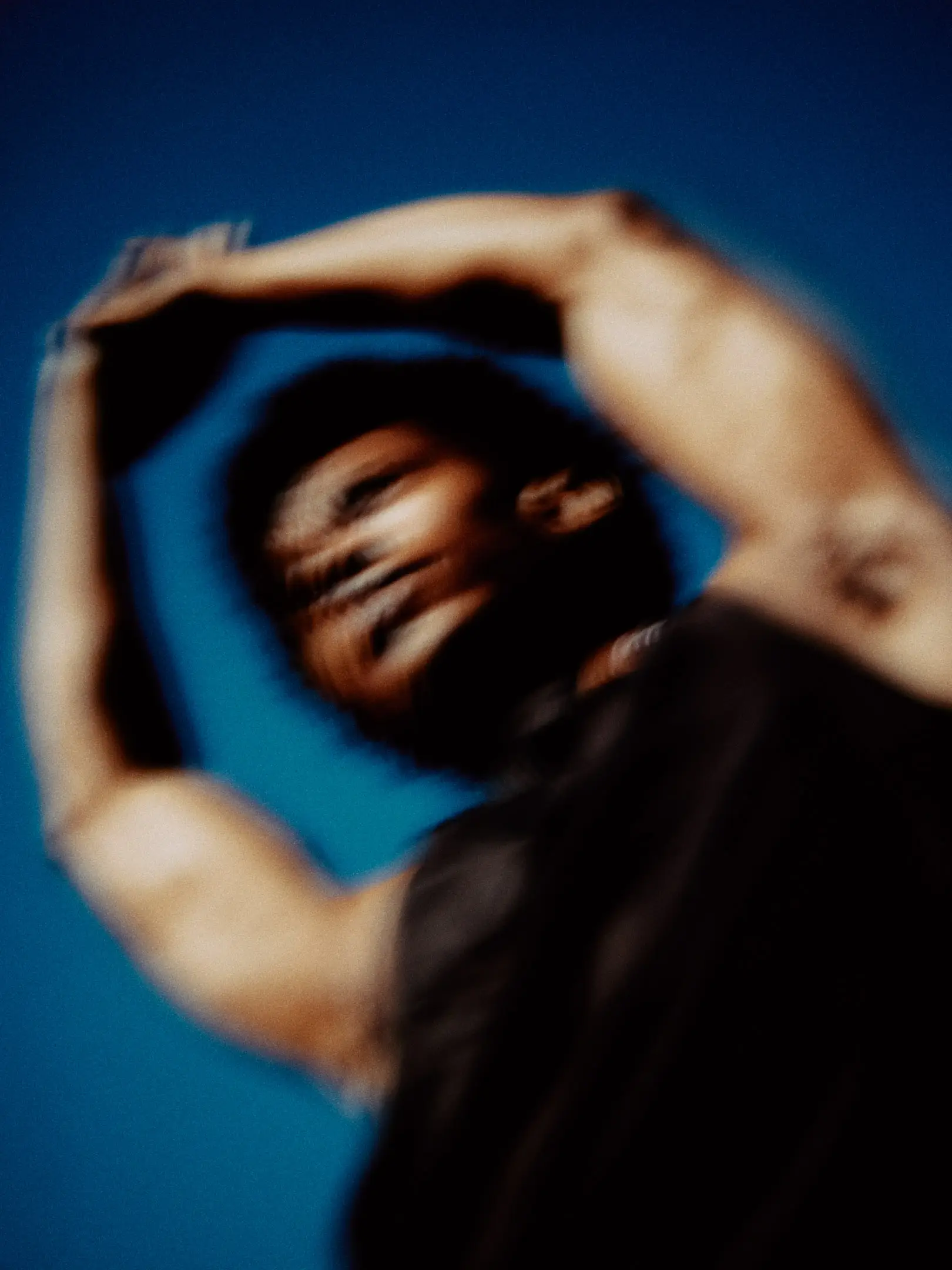 Ivory Williams, model repped by Agency Az, stretching and wearing black Nike athletic clothing, Shot for a personal project focused on athletics in Phoenix, AZ in 2023.