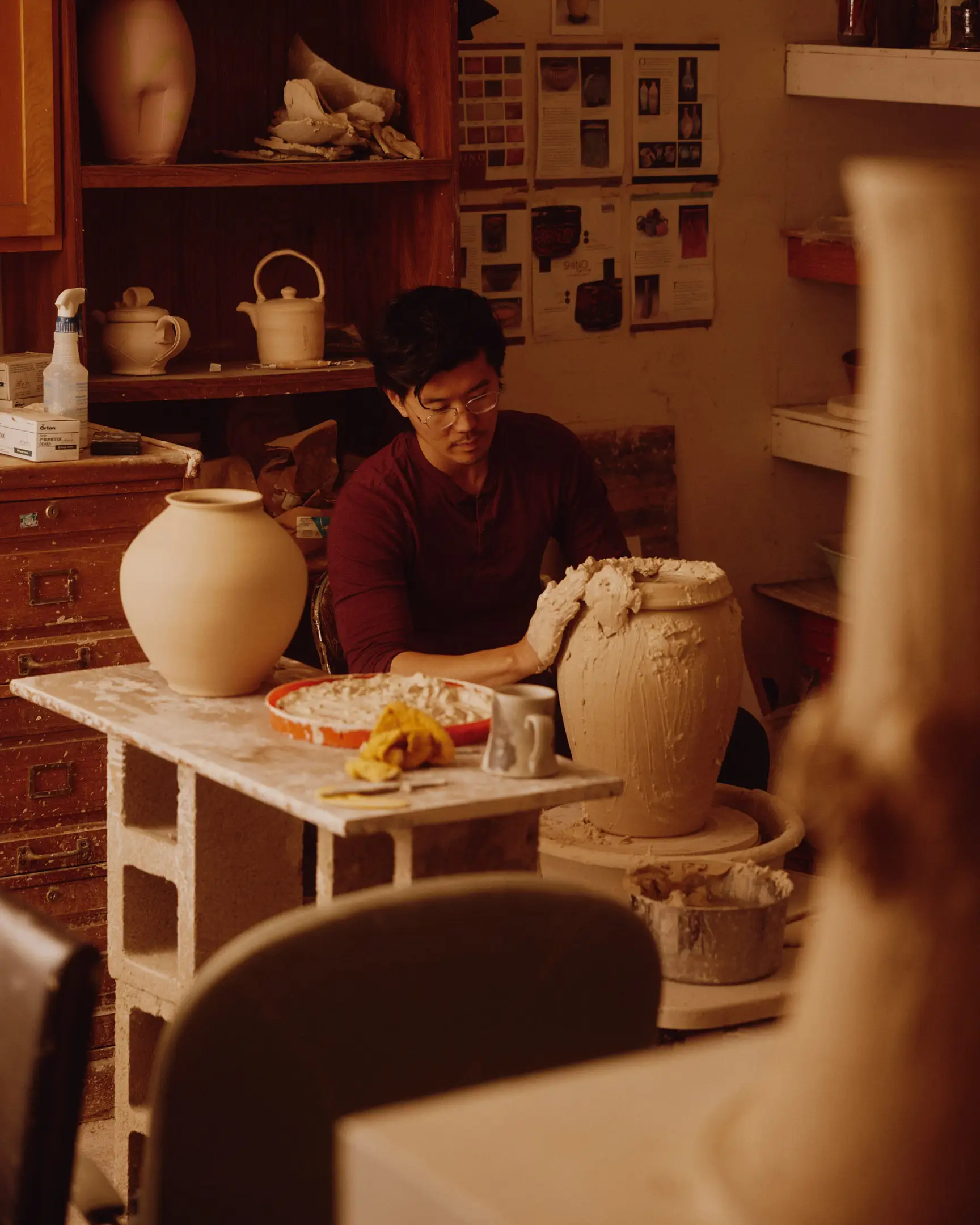 Jotham Hung working on pottery in his studio. Jotham Hung Ceramics based in Los Angeles, Ca shot originally for NAN Collective.