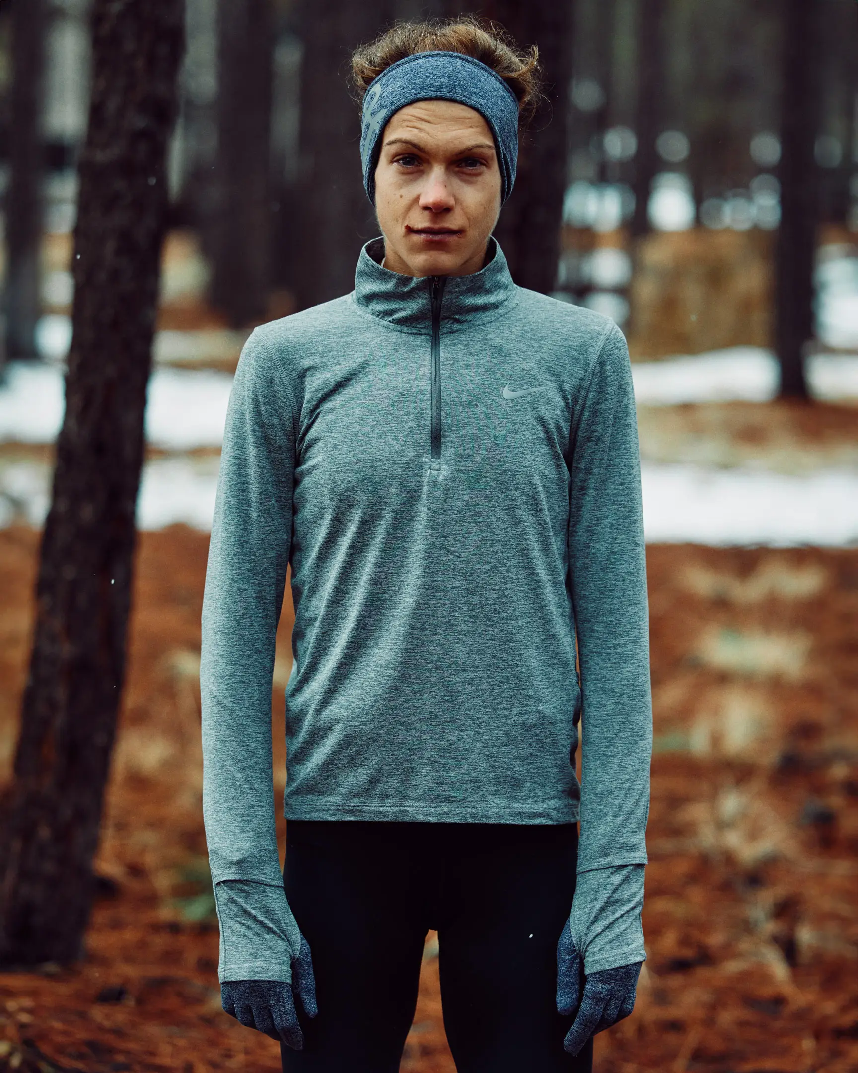 Female athlete posed against a snowy forest in Flagstaff, AZ. Dream Run Camp features the running camp hosted by Michael Fitzgerald, a runner living with long covid, that's hosted in Flagstaff, AZ. This commission was originally commissioned by The New York Times.