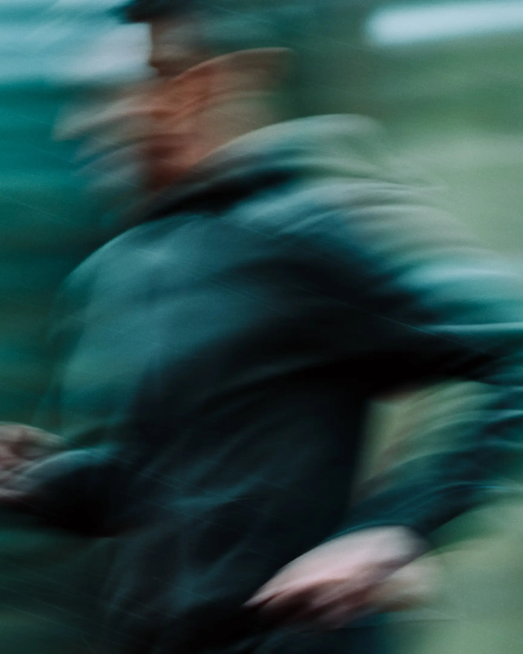 Motion blurred, action shot of a Michael Fitzgerald running through the snowy forest. Dream Run Camp features the running camp hosted by Michael Fitzgerald, a runner living with long covid, that's hosted in Flagstaff, AZ. This commission was originally commissioned by The New York Times.