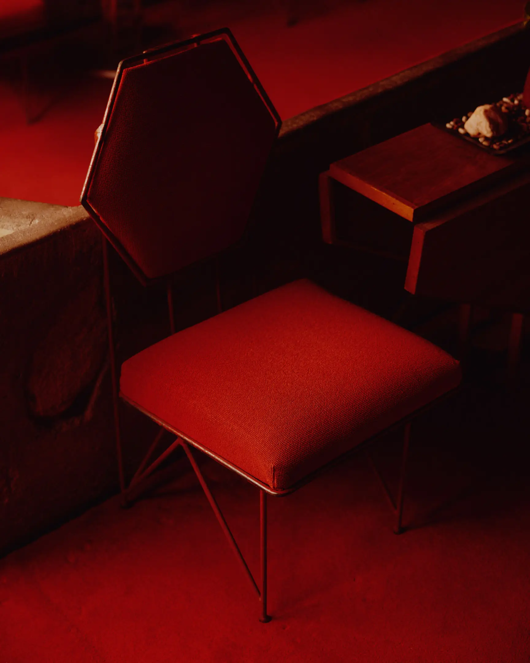 Red chair that is at Taliesin West. Taliesin West was built by Frank Lloyd Wright in Scottsdale, AZ.